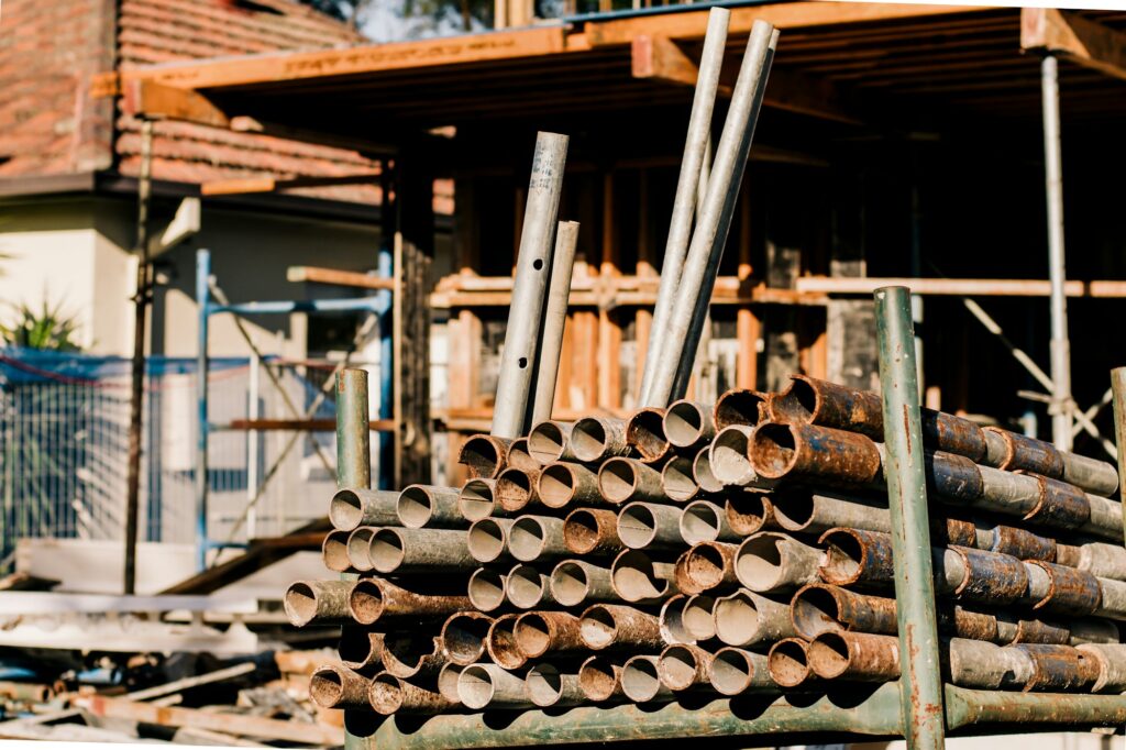 Construction work. House construction in progress . Metal pipes